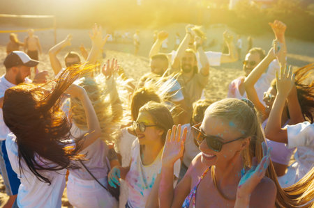 Teenagers Friends have fun at the holi festival. beach party. Celebrating traditional Indian spring...