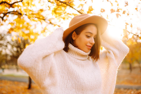 Young woman resting in nature. Fashion, style concept. People, lifestyle, relaxation and vacations.の写真素材