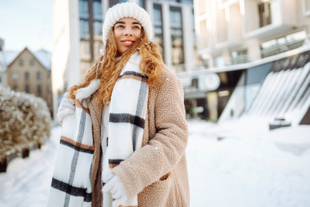 Portrait of young woman in the winter street. Fashion style.