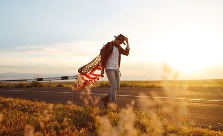 Traveler with the flag of America. Beautiful sunset light. American style.