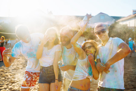 Teenagers Friends have fun at the holi festival. Beach Party. Celebrating traditional Indian spring holiday.の写真素材