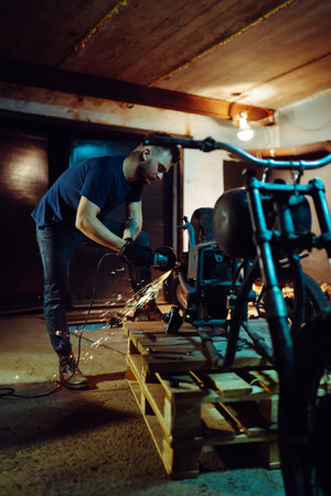 Motorcycle repair. Disassembled motorcycle. Expert works with electric welding of metal. Instrumentsの写真素材