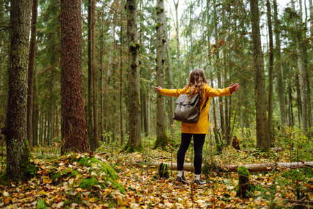Young woman explores new, fantastic places around the world, surrounded by nature relax Active Lifestyleの写真素材