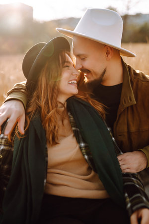 Lovely hipster couple enjoying each other in the autumn park. Nice autumn day. love and lifestyle.
