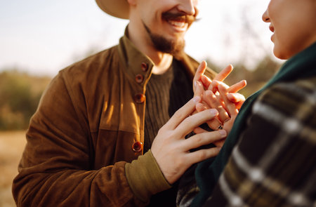 Lovely hipster couple enjoying each other in the autumn park. Nice autumn day. love and lifestyle.の写真素材