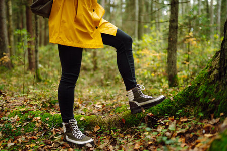 Hiking shoes of woman walking on wooden bridge. Copy Space on outdoor background. Active lifestyle