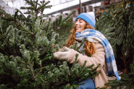 Happy person buying a New Year tree for Christmas. Holiday concept, shopping.の写真素材