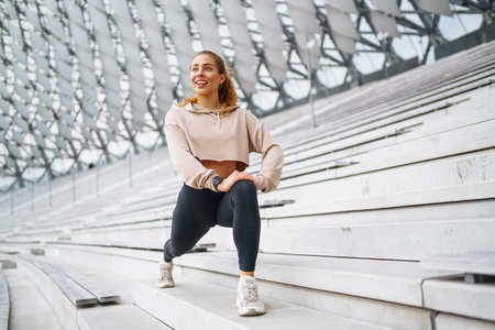 Beautiful woman outdoors and sportswear doing fitness. Concept of sport, recreation.の写真素材