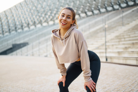 Beautiful woman outdoors and sportswear doing fitness. Concept of sport, recreation.の写真素材