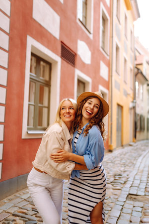 Two beautiful women having fun outdoors. Fun, weekend concept. Active lifestyle.の写真素材
