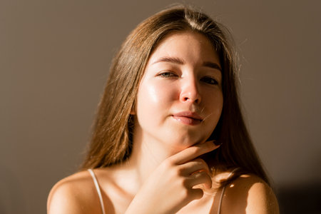 Portrait of beautiful woman without makeup with imperfect skin. Acne skin. Pores on skin of face.の写真素材