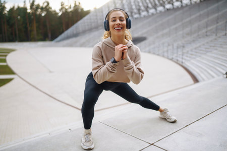 Woman, fitness and stretching in city getting ready for workout. People, sport conceptの写真素材