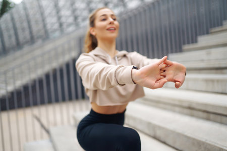 Woman, fitness and stretching in city getting ready for workout. People, sport concept
