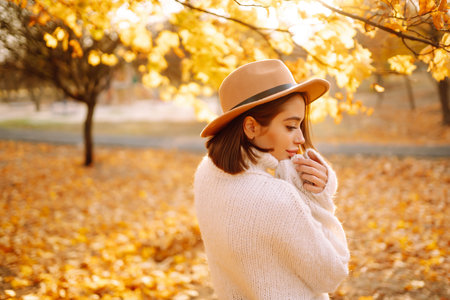 Young woman resting in nature. Fashion, style concept. People, lifestyle, relaxation and vacations.の写真素材