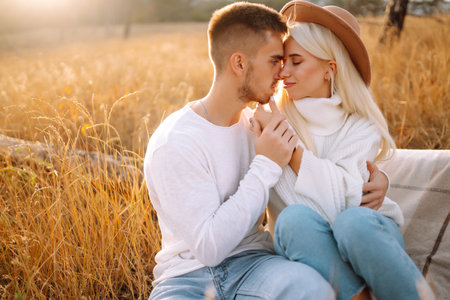 Young couple having fun walking and hugging n the park. Autumn weather. Relaxation, youth.の写真素材