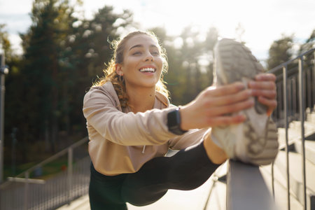Beautiful woman outdoors and sportswear doing fitness. Concept of sport, recreation.