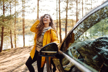 Female driver enjoying freedom and beautiful nature. Concept of traveling by car, active lifestyle.