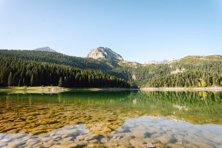 Incredible view of the lake. Rocky shore of mountain lake in the morning.