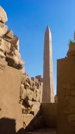 Ruins of an ancient temple of Egypt with statues and columnsの写真素材