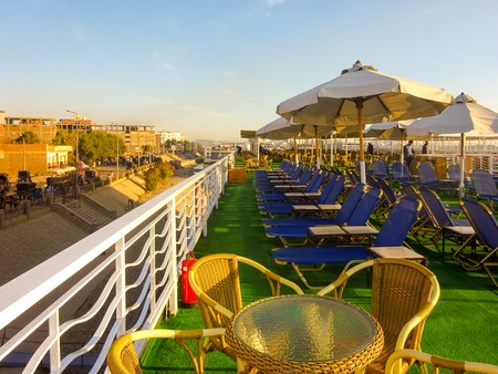Watching sunrise standing on Egyptian cruise ship upper deckの写真素材