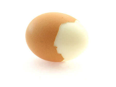 scraped brown egg isolated on white background