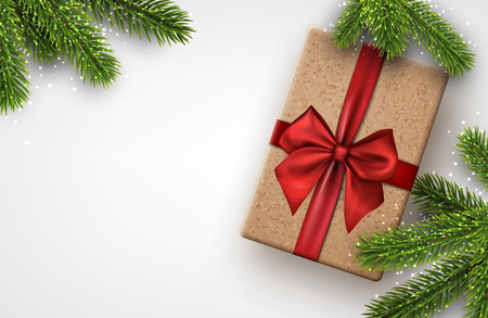 Christmas background with spruce branches and gift box. Vector top view illustration.のイラスト素材