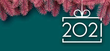 White square christmas tree toy with 2021 sign hanging on ribbon with bow. Pink spruce branches and...