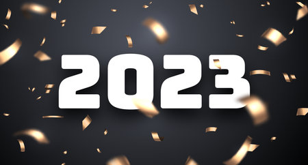 2023 sign with golden foil cut ribbon confetti on black background.