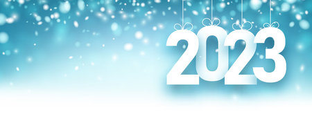 Banner with hanging 2023 sign with bows on blue snowing background. Space for text.