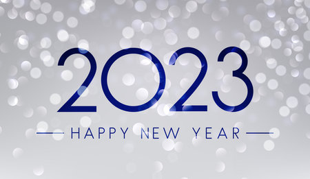 2023 happy new year sign on fogged glass. Blue bokeh snowing background.
