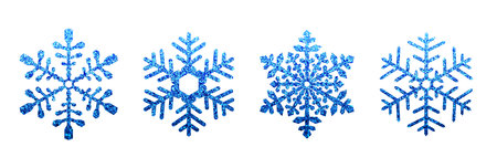 Set of detailed shiny blue snowflake icons with glittering effect. Winter design elements, frozen symbols. Vector illustrationのイラスト素材