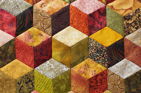 Detail of quilt sewn from pieces as diamonds