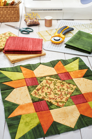 Patchwork orange-green block, quilting fabrics, sewing accessoriesの写真素材