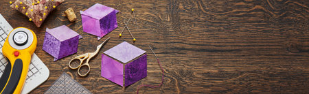 Diamonds stitched in the form of a cube. The process of sewing a quilt.の写真素材