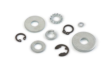Metal washers different shapes and sizes on a white background, cut out, photo stacking