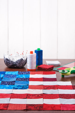 Preparing to sewing of pieces of fabrics that look like a flag of USAの写真素材