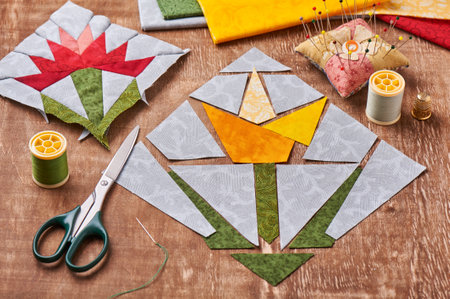 Sewing two patchwork blocks of flowers from quilt fabric, accessoriesの写真素材