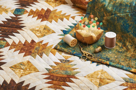 Quilt sewn of pineapple blocks, sewing accessories on back of quilt
