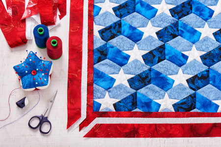 Sewing of quilt with stylized elements of American flagの写真素材