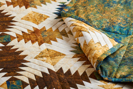 Fragment of quilt stitched from pineapple pattern blocks, traditional patchworkの写真素材