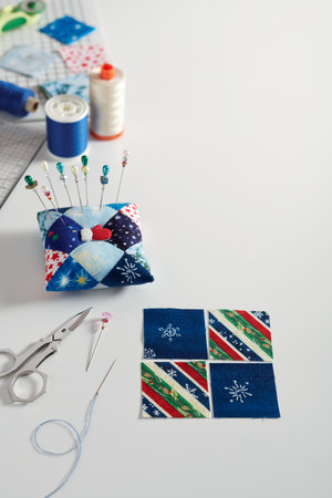 Preparing of square pieces of fabrics for sewing quilt, pincushion,  sewing and quilting accessories