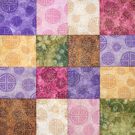 Sewn bright square pieces of fabrics, part of quilt, traditional patchworkの写真素材