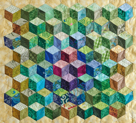 Fragment of quilt sewn from diamonds and has view three-dimensionalの写真素材