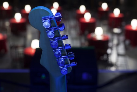 Guitar and other musical equipment on stage before concertの写真素材