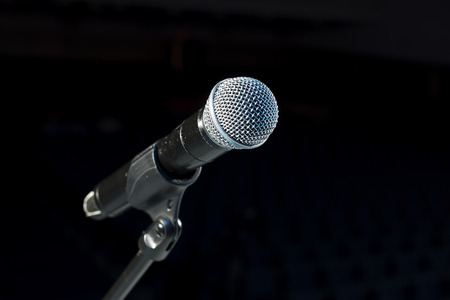 Microphone on stage against a backgroundの写真素材