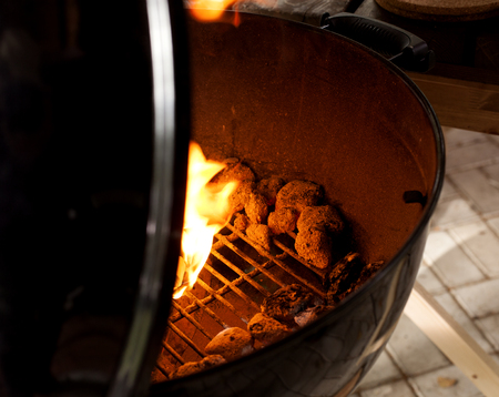 Hot barbecue fire with glowing coals ready to cook.の写真素材