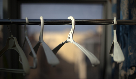 Chaotically places hangers wardrobe on the rack.の写真素材