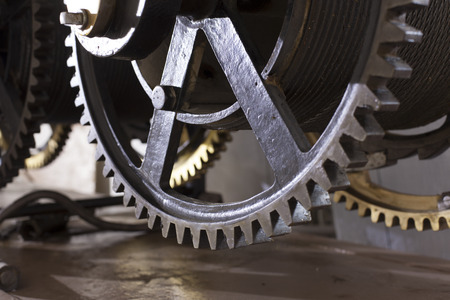 ancient mechanism of the tower clock, cogwheels in the clockの写真素材