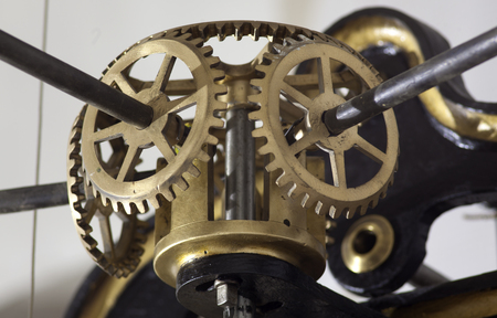 ancient mechanism of the tower clock, cogwheels in the clockの写真素材