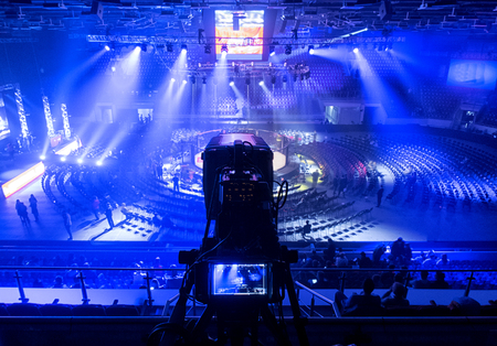 Octagonal for fights without rules, tv camera in competitions in mixed martial arts.
